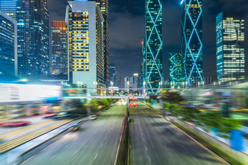 busy urban traffic of shenzhen downtown district at night