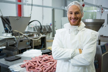  Male Butcher Standing With Arms Crossed