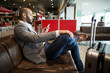 © Wavebreak Media - Businessman using mobile phone in waiting area