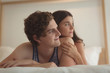 © Wavebreak Media - Young couple lying on bed at home