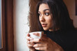 © Wavebreak Media - Beautiful woman having a cup of coffee in café