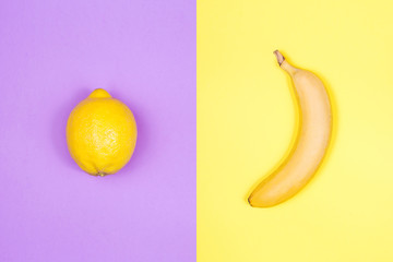 Wall Mural - Creative layout of lemon and banana on bright background