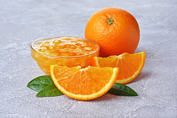 Wall Mural - Fresh ripe orange fruit with jam in glass bowl