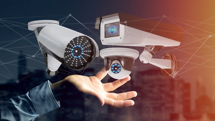 Poster - Businessman holding a Security camera system and network connection - 3d rendering