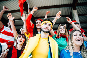 Wall Mural - Football fans supporting their team at the arena for the world championship,