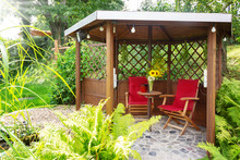 Garden Pavilion At The Garden Pond With Sitting Area And Trellis