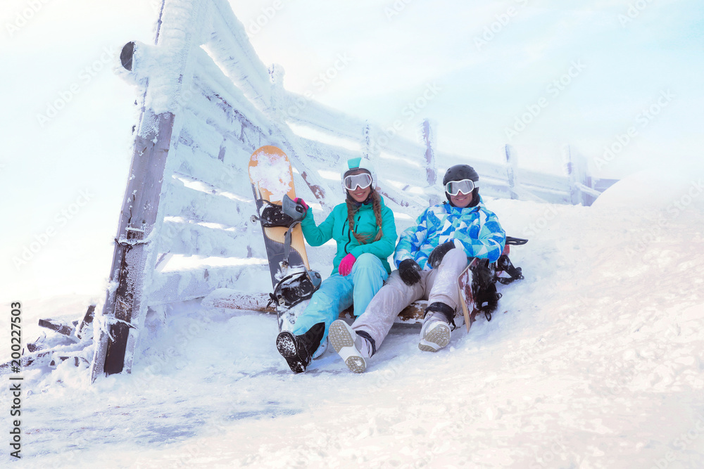 Young couple at snowy resort. Winter vacation