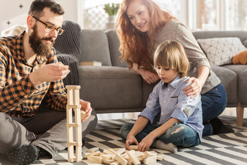 Parents playing with son