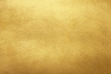 gold background. rough golden texture. luxurious gold paper template for text design, lettering.