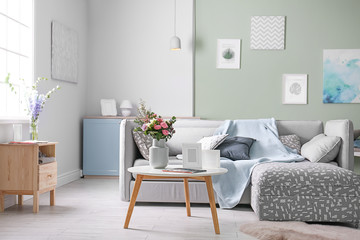 Sticker - Cozy living room interior with comfortable sofa and elegant table