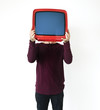 © Rawpixel.com - Man standing and holding a TV