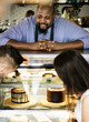 © Rawpixel.com - Customers choosing cake at the display fridge