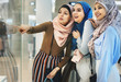 Islamic women friends shopping together at store