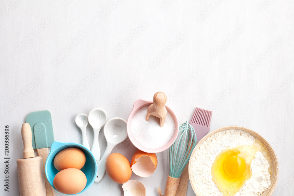 Baking utensils and cooking ingredients for tarts, cookies, dough and pastry. Flat lay with eggs, flour, sugar, berries.Top view, mockup for recipe, culinary classes, cooking blog. - obrazy, fototapety, plakaty 