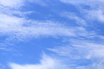 Blue bright clear sky and white cloud. Scene of sunny nature. Cloudscape