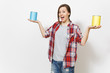 © ViDi Studio - Young fun beautiful woman in casual clothes holding empty paint tin cans with copy space isolated on white background. Instruments, accessories for renovation apartment room. Repair home concept.