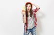 © ViDi Studio - Irritated shocked woman in protective construction orange helmet holding toy saw and clinging to head isolated on white background. Instruments for renovation apartment room. Repair home concept.
