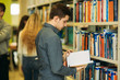 © Aleksandr - Group of student want to find some helpful literature to preparing for university exam