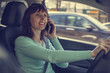 © evgenii - Beautiful girl talking on the phone while driving
