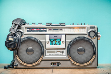 Wall Mural - retro outdated portable stereo boombox radio cassette recorder from circa late 70s with aged headpho