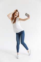 Sticker - Full length image of Playful woman in casual clothes