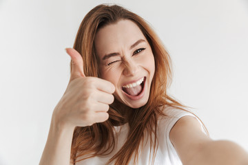 Poster - Cheerful woman in casual clothes making selfie