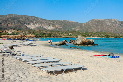 Plage Et Transat De Lîle De Crète En Grèce Buy This Stock