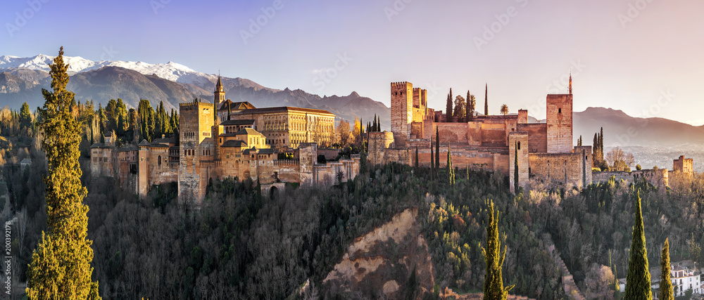 Palace and fortress complex Alhambra with Comares Tower, Palacios Nazaries and Palace of Charles V during sunset in Granada, Andalusia, Spain. - obrazy, fototapety, plakaty 