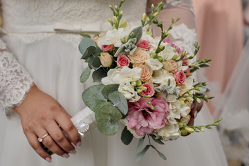 Wall Mural - Wedding flowers in hand the bride and her bridesmaids. A feast for brides