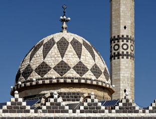 Detail of the black and white Abu Darwish Mosque in Amman