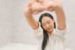 © obeyleesin - Young beautiful Asian girl waking up after a long sleep, enjoying her time to relax