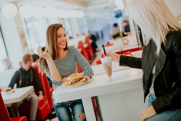 Two young women in diner