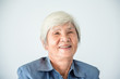 Closeup senior asian female with white color hair smiling at camera