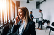 © bnenin - Close-up image of smiling businesswoman talking on a cellphone.