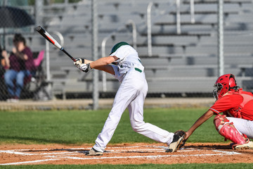 Baseball player swinging the bat