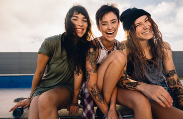 Female skater having great time at skate park