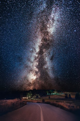 Wall Mural - Milky Way galaxy over the forest and road. Milky Way galaxy over the mountain forest and road, Rajac, Serbia. The night sky is astronomically accurate.