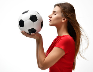 Wall Mural - Fan sport woman player in red uniform hold soccer ball celebrating looking at the corner 