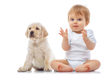 Wall Mural - Baby boy with puppy, isolated on white