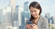 © leungchopan - Asian business woman use of mobile phone