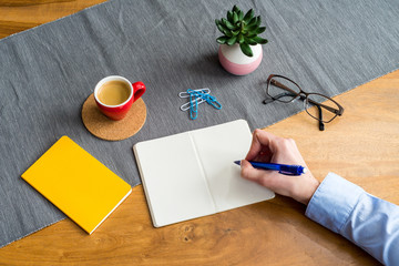 Wall Mural - Empty notebook with copy space and hand as flat lay and template