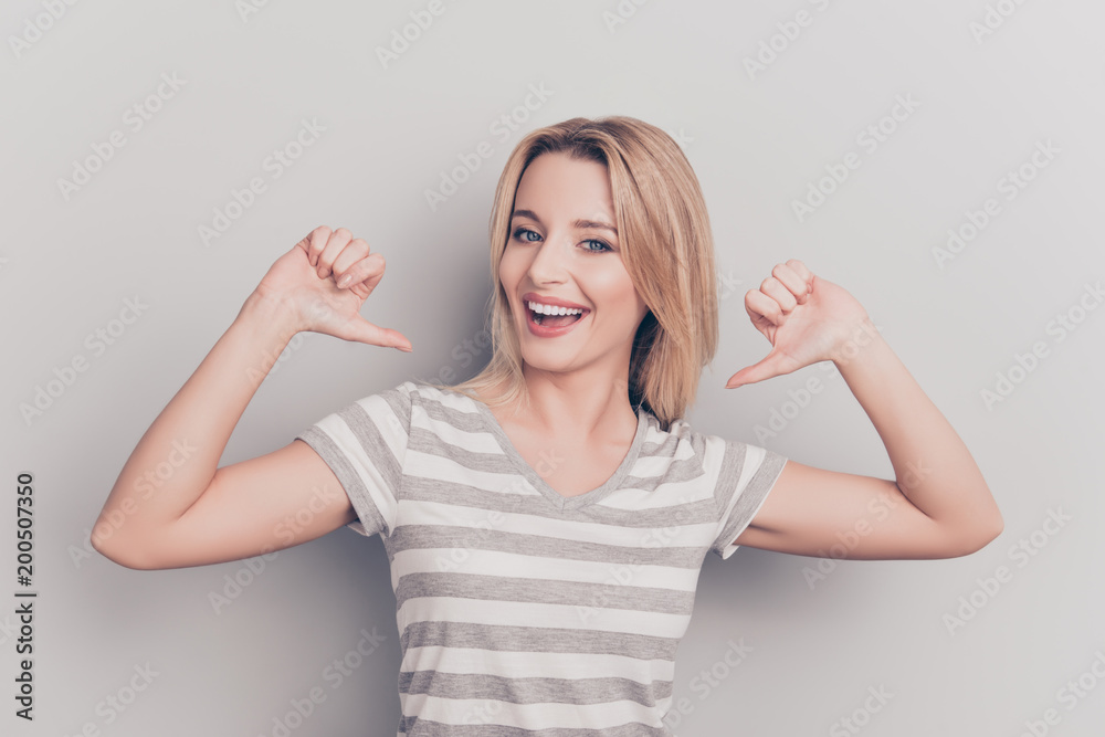 It is me! Portrait of smiling cheerful nice modern cute positive woman in casual outfit pointing thumb fingers at her body isolated on grey background, proud of herself, having ego - obrazy, fototapety, plakaty 