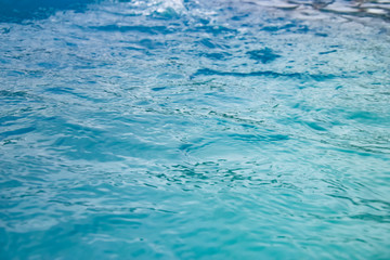 clear turquoise water with sun reflections