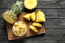 Wooden Board With Fresh Sliced Pineapple On Table, Top View