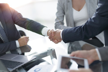 confident handshake of business partners