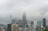 Fototapeta  - Hong Kong: View from Stubbs Road Lookout across Wan Chai to Tsim Sha Tsui with a large construction site on a rainy summer day