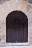 Fototapeta Desenie - Old door in Calaceite village in Teruel Spain