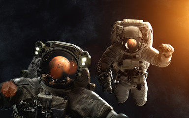 Wall Mural - astronauts in front of mars. solarsystem. image in 5k resolution for desktop wallpaper. elements of 