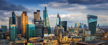 London, England - Panoramic Skyline View Of Bank And Canary Wharf, London's Leading Financial Districts With Famous Skyscrapers And Other Landmarks At Golden Hour Sunset With Blue Sky And Clouds