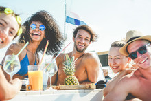 Group Of Happy Friends Drinking Tropical Cocktails At Boat Party - Young People Having Fun In Caribbean Sea Tour Eating Pineapple And Laughing - Youth And Summer Vacation Concept